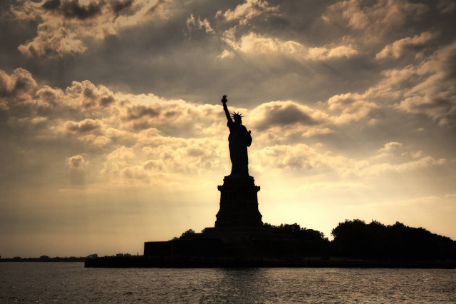 Liberty silhouette cloudy sky water free wallpaper - medium preview image
