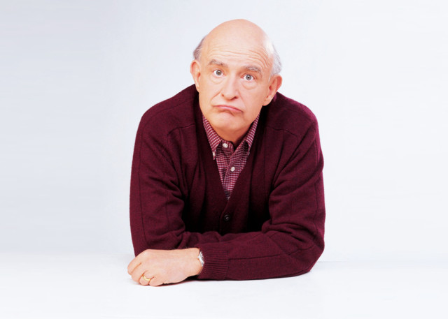 Man sitting floor arms crossed free wallpaper - medium preview image