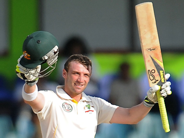 Man holding bat helmet ball free wallpaper - medium preview image