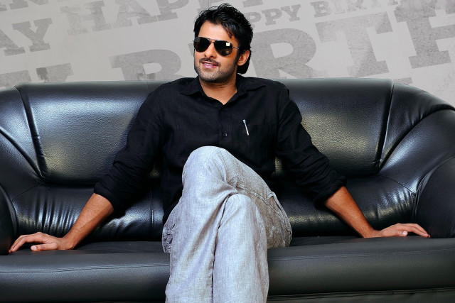 Man sitting couch legs crossed #4 free wallpaper - medium preview image