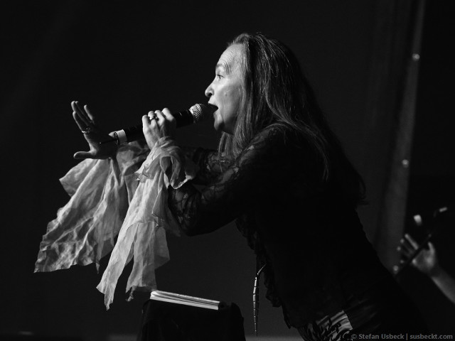 Woman singing microphone stage book free wallpaper - medium preview image