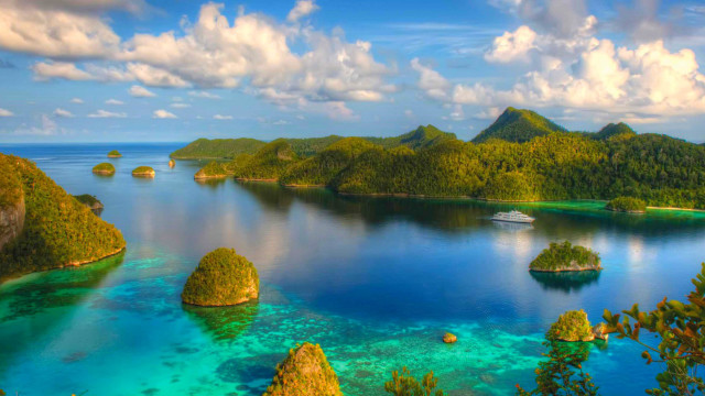 Blue lagoon mountains boat sky free wallpaper - medium preview image