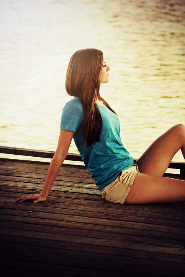Woman sitting dock water boat free wallpaper - medium preview image