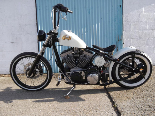 Motorcycle parked blue building blue free wallpaper - medium preview image
