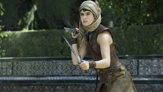 Woman costume sword holding action free wallpaper - medium preview image