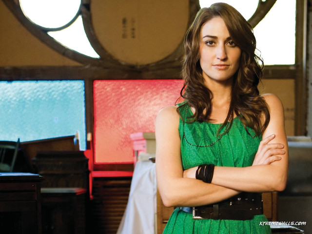Woman green dress arms crossed free wallpaper - medium preview image