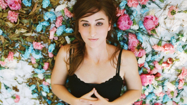 Woman laying bed flowers hands free wallpaper - medium preview image