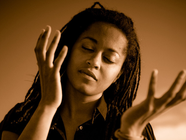 Woman dreadlocks hands up closed free wallpaper - medium preview image