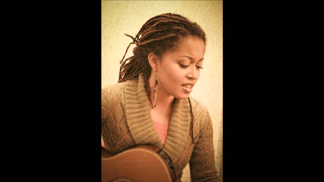 Woman dreadlocks playing guitar room free wallpaper - medium preview image