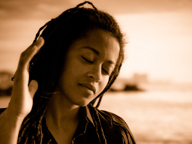 Woman dreadlocks boat portrait blurry free wallpaper - medium preview image