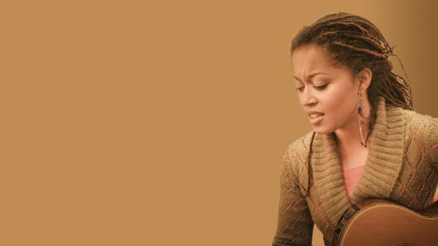 Woman dreadlocks playing guitar studio free wallpaper - medium preview image
