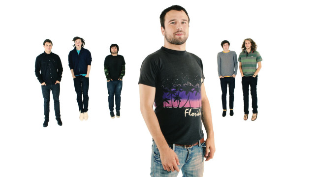 Man standing group people tshirts free wallpaper - medium preview image