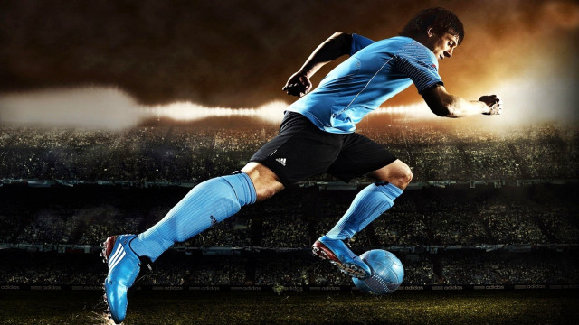 Soccer player kicking ball stadium #5 free wallpaper - medium preview image