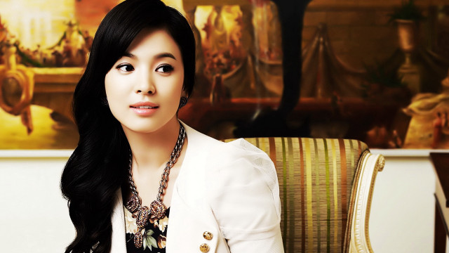 Woman sitting chair suit necklace free wallpaper - medium preview image