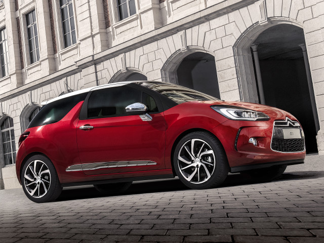 Red car parked building brick free wallpaper - medium preview image