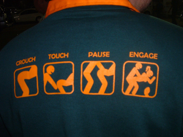Man green shirt orange lettering free wallpaper - medium preview image