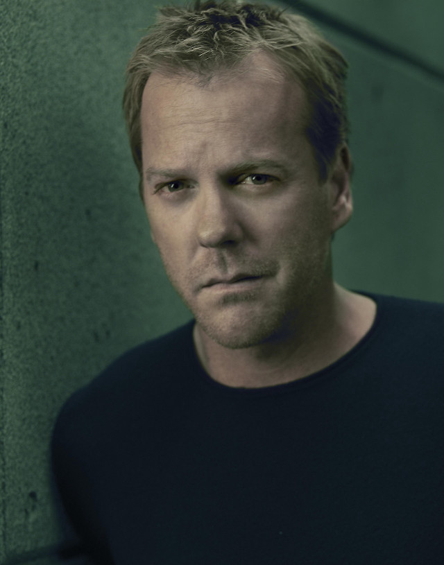 Man black shirt leaning wall #3 free wallpaper - medium preview image