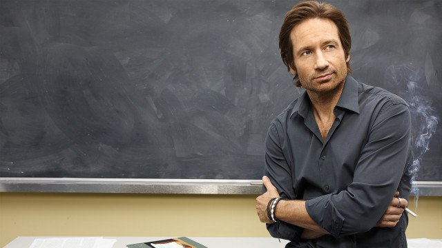Man standing chalkboard arms crossed free wallpaper - medium preview image