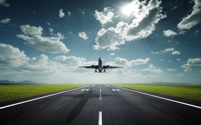 Jetliner flying runway blue sky free wallpaper - medium preview image