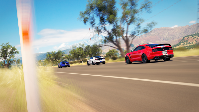 Red car driving road forest #6 free wallpaper - medium preview image