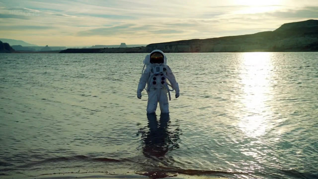 Man space suit water mountain free wallpaper - medium preview image