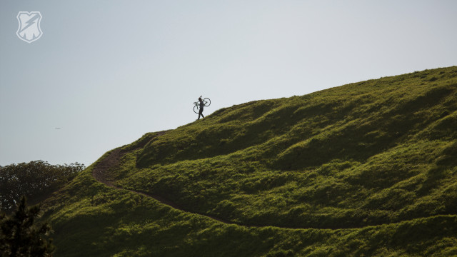 Person standing grassy hill kite free wallpaper - medium preview image