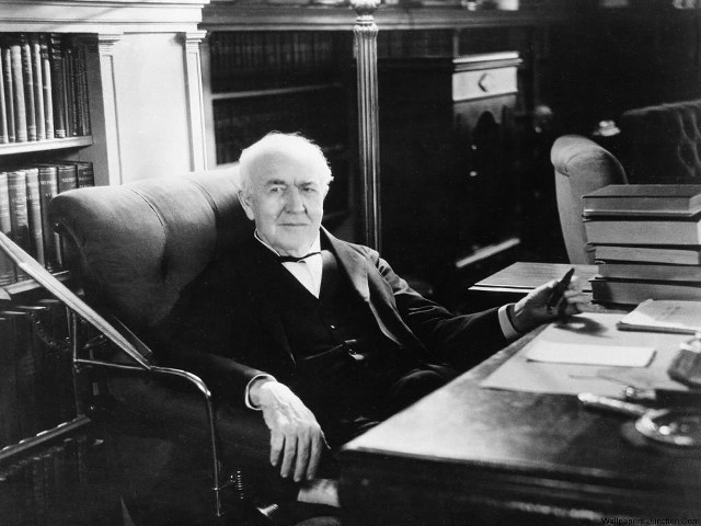 Man sitting chair desk bookcase free wallpaper - medium preview image
