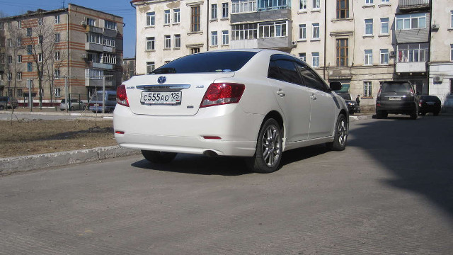 White car parked road building #3 free wallpaper - medium preview image