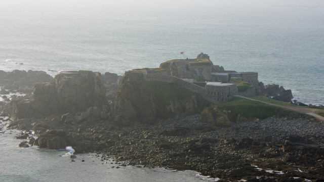 Castle rocky cliff ocean shore free wallpaper - medium preview image
