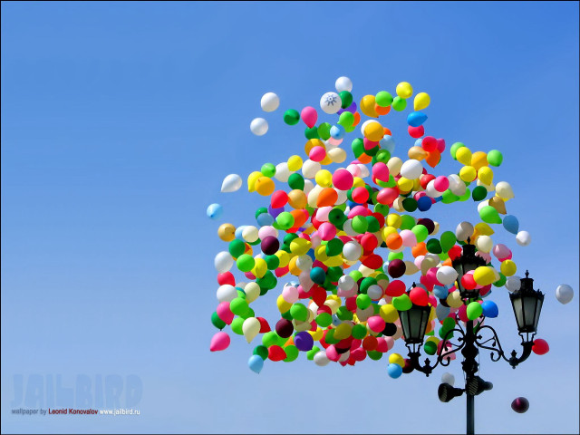Balloons floating above street light free wallpaper - medium preview image