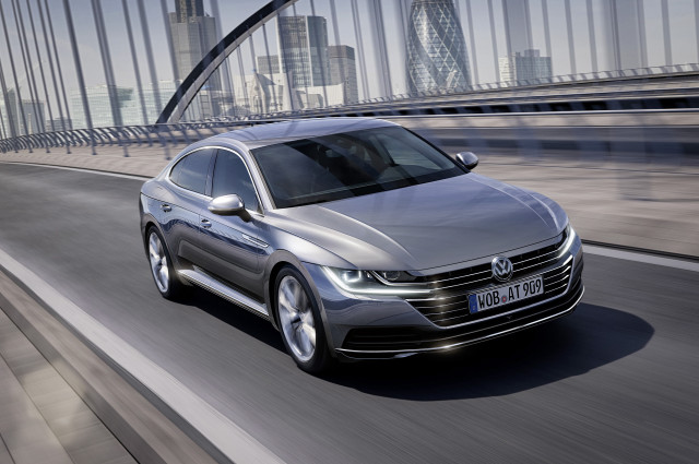 Silver volkswagen arteus driving city free wallpaper - medium preview image