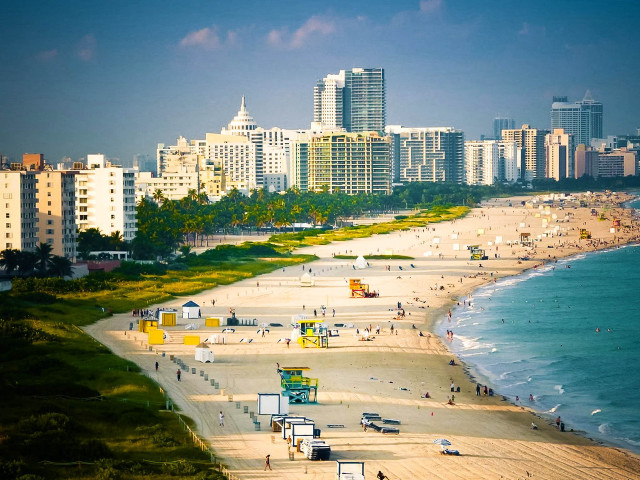 Beach city people walking sand free wallpaper - medium preview image
