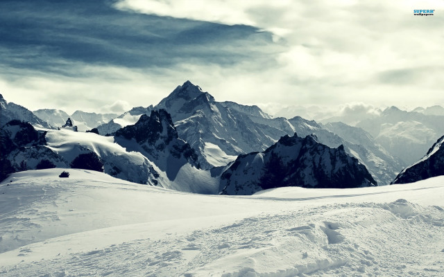 Person skiing snowy mountain slope free wallpaper - medium preview image