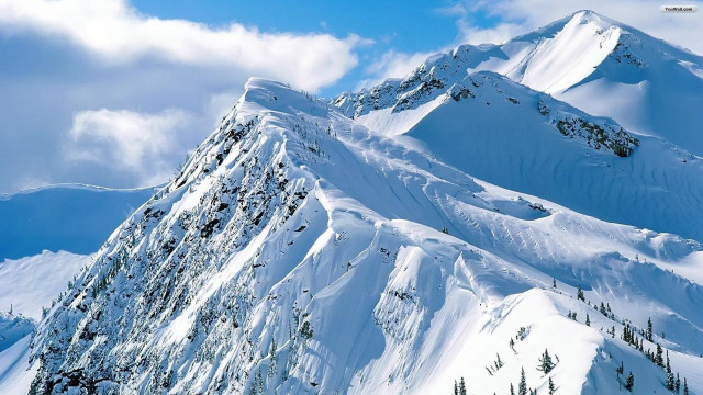 Snowy mountain sky clouds snowboarder free wallpaper - medium preview image