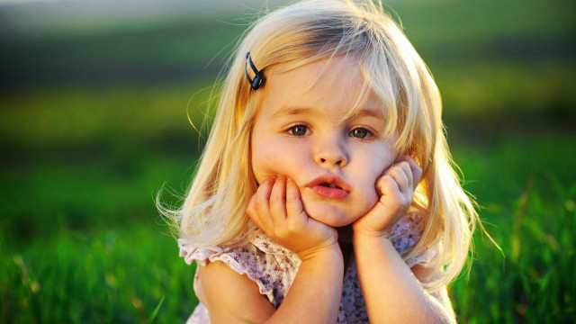Little girl grass hands face #5 free wallpaper - medium preview image