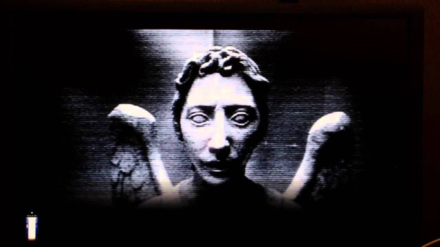 Creepy television face hands behind free wallpaper - medium preview image