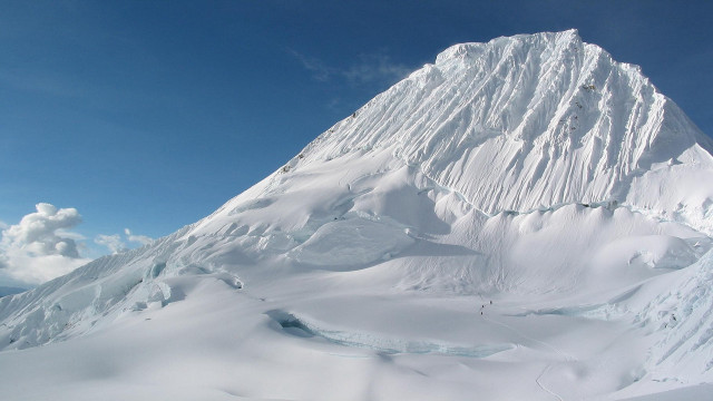 Snow covered mountain skier skiing #2 free wallpaper - medium preview image