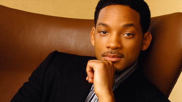 Man suit chair chin resting free wallpaper - medium preview image