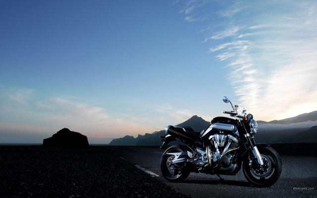 Motorcycle parked mountains clouds sunset free wallpaper - medium preview image