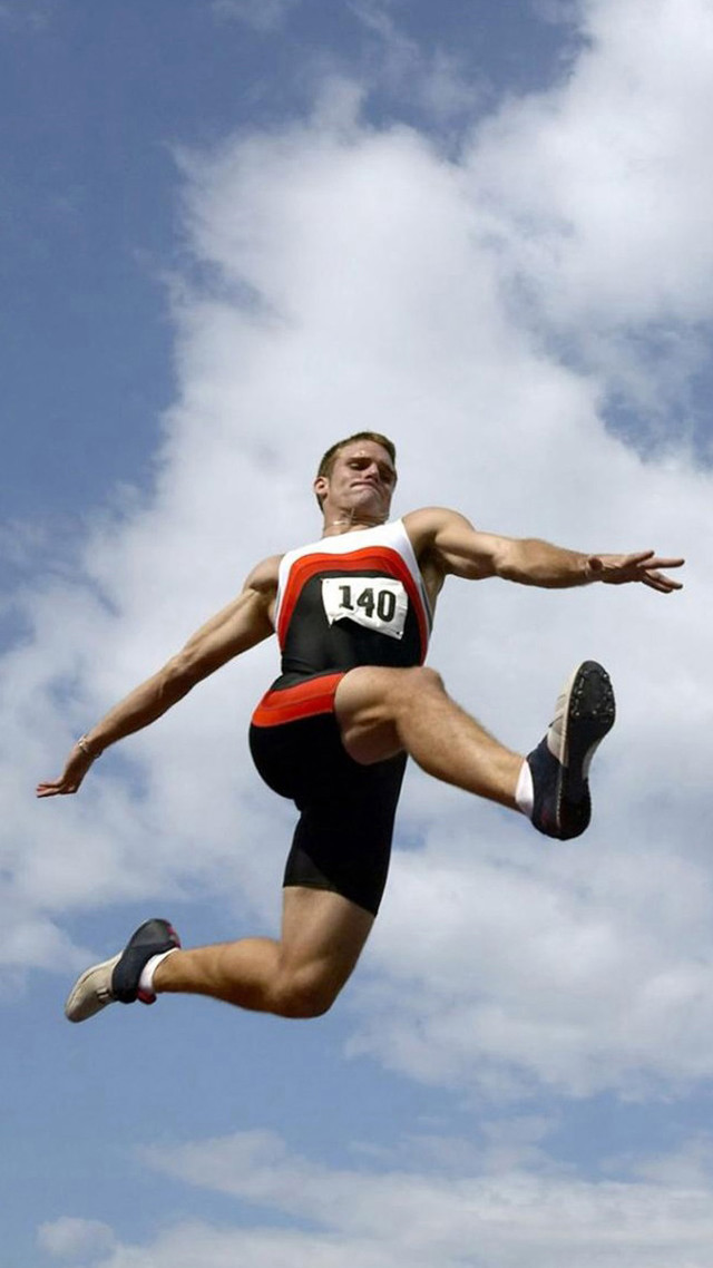 Man jumping competition event grass free wallpaper - medium preview image
