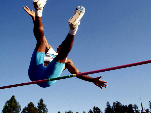 Woman high jump pole shoes free wallpaper - medium preview image