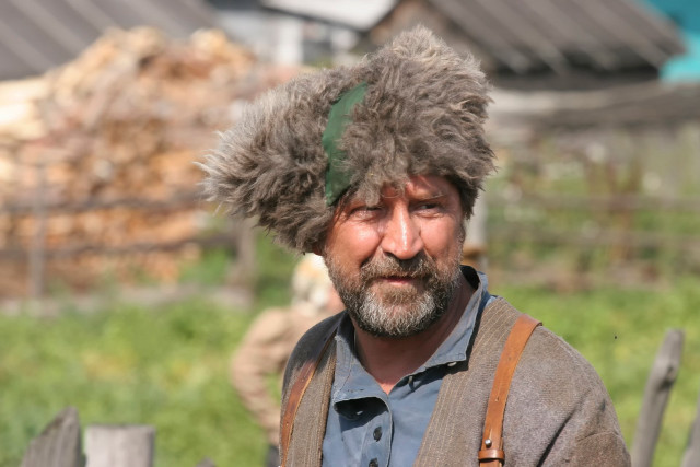 Man furry hat hay bag free wallpaper - medium preview image