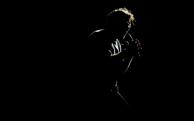 Person standing dark cellphone light free wallpaper - medium preview image