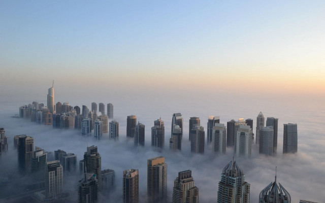 Foggy city skyscrapers clouds background free wallpaper - medium preview image