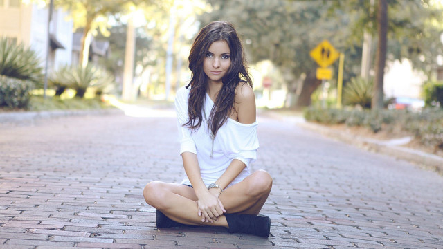 Woman sitting brick road legs free wallpaper - medium preview image