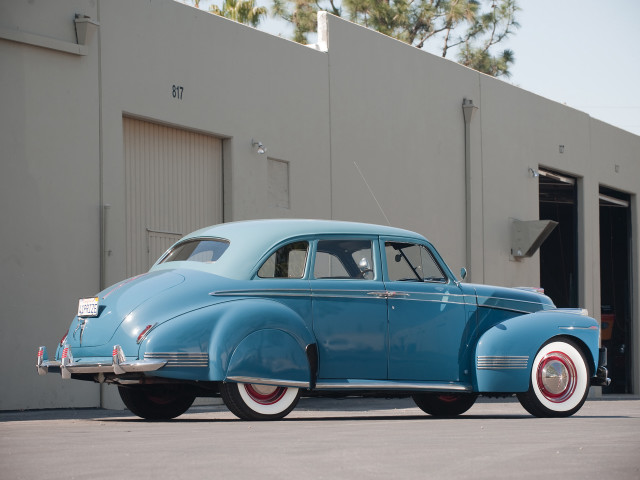 Blue car parked building garage free wallpaper - medium preview image