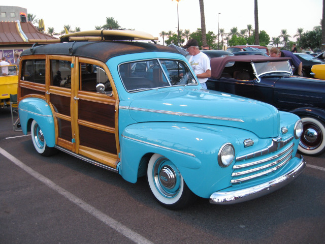 Blue car surfboard parking lot free wallpaper - medium preview image