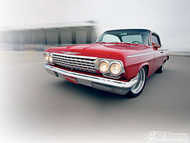 Red car driving street building #5 free wallpaper - medium preview image