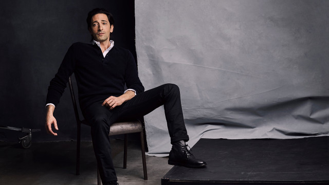 Man sitting portrait black clothing free wallpaper - medium preview image