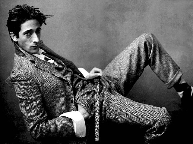 Man suit tie sitting chair free wallpaper - medium preview image
